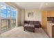 Bright living room featuring a large sliding glass door with great views and comfortable seating at 2405 W Serene Ave # 631, Las Vegas, NV 89123