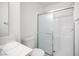 Bathroom showcasing a white vanity, toilet, and shower with sliding glass doors at 2430 Old Forge Ln # 106, Las Vegas, NV 89121