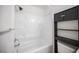 Bathroom with a bath and shower combination and storage shelves at 2430 Old Forge Ln # 106, Las Vegas, NV 89121