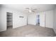 Bedroom featuring neutral carpet, ceiling fan, and doorways to the hall and closet at 2430 Old Forge Ln # 106, Las Vegas, NV 89121