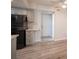 Kitchen area featuring gray cabinets and black appliances at 2430 Old Forge Ln # 106, Las Vegas, NV 89121