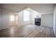 Inviting living area with a fireplace, modern flooring, and natural light at 2430 Old Forge Ln # 106, Las Vegas, NV 89121