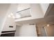 View showcasing the living room's high ceilings, modern fixtures, and open layout at 2430 Old Forge Ln # 106, Las Vegas, NV 89121