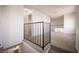 An open loft space features neutral carpeting and railings at 2430 Old Forge Ln # 106, Las Vegas, NV 89121