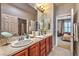 Bathroom features double sinks, spacious countertop, and access to bedroom at 2824 Soaring Peak Ave, Henderson, NV 89052