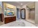 Bright bathroom features a soaking tub, walk-in shower, and double sink vanity at 2824 Soaring Peak Ave, Henderson, NV 89052