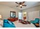 This bedroom features a ceiling fan, walk in closet, and access to an en suite bathroom at 2824 Soaring Peak Ave, Henderson, NV 89052