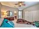 Cozy bedroom boasts a ceiling fan, carpet, and an ensuite bathroom at 2824 Soaring Peak Ave, Henderson, NV 89052