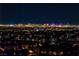 Spectacular nighttime view of a city skyline from a residential neighborhood at 2824 Soaring Peak Ave, Henderson, NV 89052