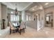 Formal dining room featuring a decorative chandelier and a dark wood dining table set at 2824 Soaring Peak Ave, Henderson, NV 89052