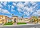 Charming single-Gathering home featuring a well-manicured lawn, desert landscaping, and a classic architectural design at 2824 Soaring Peak Ave, Henderson, NV 89052