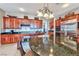 Spacious kitchen with stainless steel appliances, dark countertops, and ample cabinet space at 2824 Soaring Peak Ave, Henderson, NV 89052