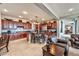 Open concept kitchen with an island, wooden cabinets, and seamless flow into the living area at 2824 Soaring Peak Ave, Henderson, NV 89052