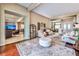 Open-concept living room showcases hardwood floors, neutral tones, and seamless transitions to dining and entertainment spaces at 2824 Soaring Peak Ave, Henderson, NV 89052
