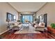 Bright and airy living room with a large sliding glass door that opens to a patio and city views at 2824 Soaring Peak Ave, Henderson, NV 89052