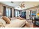 Well-appointed main bedroom featuring plush carpeting, natural light, and an en-suite bathroom at 2824 Soaring Peak Ave, Henderson, NV 89052