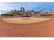 Wide shot of community baseball field featuring dirt, grass, fencing, and surrounding homes at 2905 Haddon Dr, Las Vegas, NV 89134