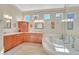Bathroom features granite countertop, soaking tub, dual vanity, and natural light streaming through multiple windows at 2905 Haddon Dr, Las Vegas, NV 89134