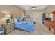 Comfortable bedroom boasts a ceiling fan, carpeting, neutral paint, and a queen bed with decorative pillows at 2905 Haddon Dr, Las Vegas, NV 89134