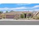 Attractive single-story home with a tile roof, desert landscaping, and a two-car garage at 2905 Haddon Dr, Las Vegas, NV 89134