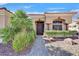 Charming front entrance showcasing a stone pathway, mature landscaping, and covered entry way at 2905 Haddon Dr, Las Vegas, NV 89134