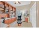 Well-lit home office features built-in shelving, cabinets, a ceiling fan, and a comfortable work space at 2905 Haddon Dr, Las Vegas, NV 89134