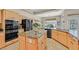 Spacious kitchen with stainless steel appliances, ample cabinet space, granite countertops, and an island with sink at 2905 Haddon Dr, Las Vegas, NV 89134