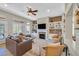 Inviting living room with a fireplace, custom built-ins, plush seating, and stylish decor at 2905 Haddon Dr, Las Vegas, NV 89134