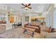 Bright living room featuring an open-concept layout, recessed lighting, and seamless access to the kitchen at 2905 Haddon Dr, Las Vegas, NV 89134