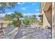 Outdoor patio featuring an ornate bench, pavers, landscaping and views beyond a fence at 2905 Haddon Dr, Las Vegas, NV 89134