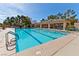 Long swimming pool with multiple lanes, clear water, and trees for shade to the side at 2905 Haddon Dr, Las Vegas, NV 89134