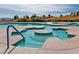 Unique community pool features concrete islands, crystal water, blue railings, and access stairs at 2905 Haddon Dr, Las Vegas, NV 89134
