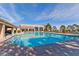 Bright community pool featuring clear water, handrails, deck furniture, and views of the clubhouse at 2905 Haddon Dr, Las Vegas, NV 89134