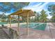 Outdoor shuffleboard courts featuring benches, shade structures, and views of the community at 2905 Haddon Dr, Las Vegas, NV 89134