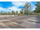 Long outdoor shuffleboard courts with benches, lighting, fences, and shade trees at 2905 Haddon Dr, Las Vegas, NV 89134