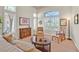 Cozy sitting room with a large window, plantation shutters, comfortable seating, and plenty of natural light at 2905 Haddon Dr, Las Vegas, NV 89134