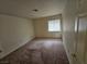 Neutral bedroom featuring simple design elements and a window for natural light at 3100 Gladstone Ct, Las Vegas, NV 89134