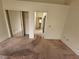 Large bedroom with mirrored closet doors and neutral walls at 3100 Gladstone Ct, Las Vegas, NV 89134
