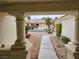 Inviting front entrance with decorative columns framing a view of the home's exterior and desert landscape at 3100 Gladstone Ct, Las Vegas, NV 89134