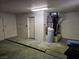 Spacious garage with concrete floor and utilitarian design, including utility equipment at 3100 Gladstone Ct, Las Vegas, NV 89134