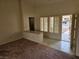 Comfortable living room featuring tile flooring and access to the front porch at 3100 Gladstone Ct, Las Vegas, NV 89134
