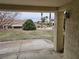 Spacious covered patio offering serene views of the well-maintained lawn and surrounding landscape at 3100 Gladstone Ct, Las Vegas, NV 89134