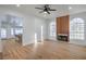 Spacious living room with wood flooring, a fireplace, and abundant natural light at 3104 Waterview Dr, Las Vegas, NV 89117