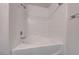 Bathroom featuring a tub with tile walls at 3125 N Buffalo Dr # 1136, Las Vegas, NV 89128