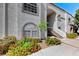 Well-maintained condominium exterior with lush landscaping and flowers that add to the inviting curb appeal at 3125 N Buffalo Dr # 1136, Las Vegas, NV 89128