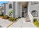 Condominium exterior with steps leading to the units; flowers and greenery add to the curb appeal at 3125 N Buffalo Dr # 1136, Las Vegas, NV 89128