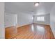 Bright and spacious living room featuring wood floors, fresh neutral paint, and ample natural light at 3125 N Buffalo Dr # 1136, Las Vegas, NV 89128