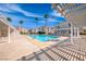 Refreshing community pool with clear blue water and shaded seating areas, perfect for relaxation at 3125 N Buffalo Dr # 1136, Las Vegas, NV 89128