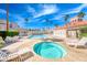 Relaxing pool area with a hot tub and lounge chairs for enjoying sunny days at 3125 N Buffalo Dr # 1136, Las Vegas, NV 89128
