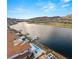 Scenic view of a lakefront community featuring luxurious homes with private docks and stunning mountain vistas at 32 Grand Corniche Dr, Henderson, NV 89011